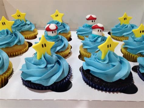 Birthday party for my oldest son! Super Mario Bros. Cupcakes topped with fondant star and ...