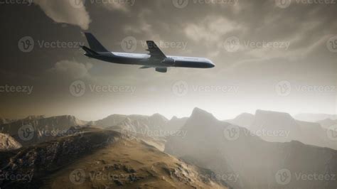 Passenger Aircraft Over Mountain Landscape 5852912 Stock Photo At Vecteezy