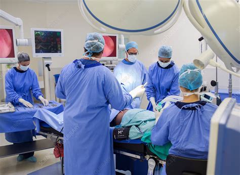 Team Of Doctors Performing Surgery Stock Image F Science