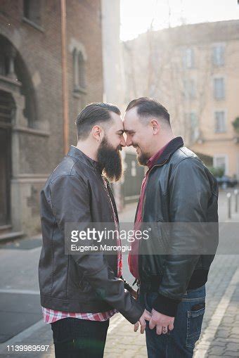 Gay Couple Holding Hands And Rubbing Noses On Street Photo Getty Images