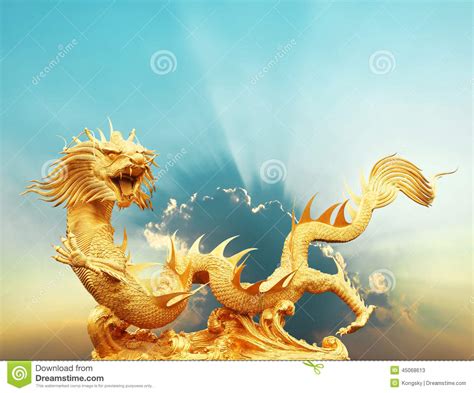 Gold Chinese Dragon Statue With Cloud And Sky Clipping Path Stock