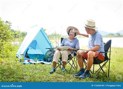 Elderly Asian Couples Camping In The Jungle Enjoying A Retirement