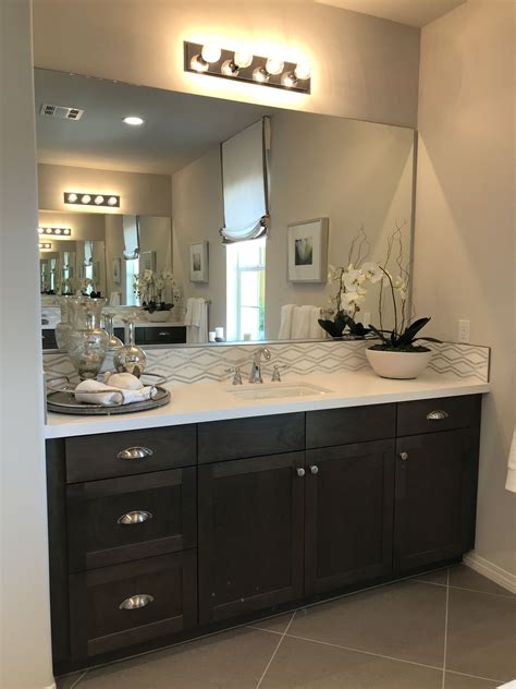 A marble countertop with sink makes a perfect match as the main element of. Bathroom Remodel Ideas. Black cabinets, White Quartz ...