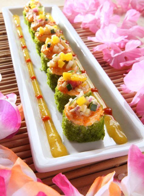 Tropical Roll Cucumber Mango And Avocado Rolled And Topped With Spinach
