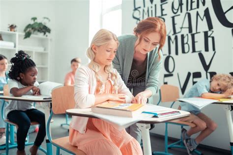 Teacher Helping Her Pupil During The Lesson Stock Image Image Of