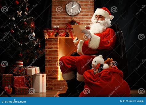 Portrait Of Happy Santa Claus Sitting At His Room At Home Stock Photo