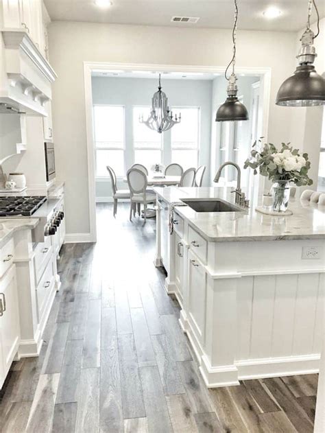 White Kitchen With Stainless Steel And Marble 