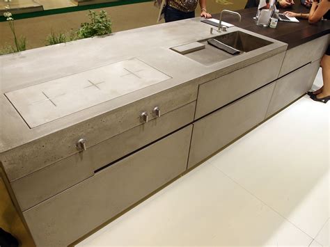 You can control the temperature settings with precision. Cool Concrete kitchen by Steininger with induction cooktop ...