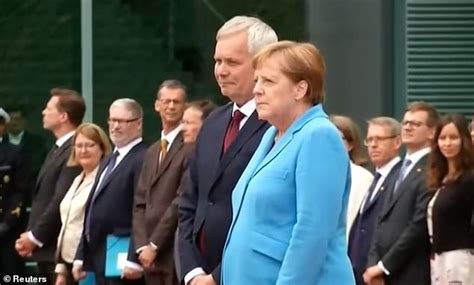 He didn't budge and most certainly didn't return her gaze. German Chancellor, Angela Merkel seen shaking for a THIRD ...