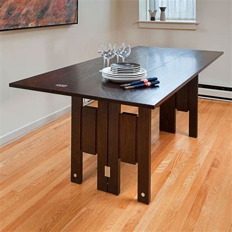 Clever use of chalkboard paint allows the underside of the unit to also serve. Love this from CustomMade | Dining table small space ...