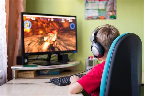 Premium Photo Child Playing Computer Games