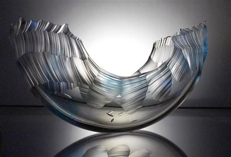 Precariously Resting Atop A Pedestal These Wave Like Glass Vessels By