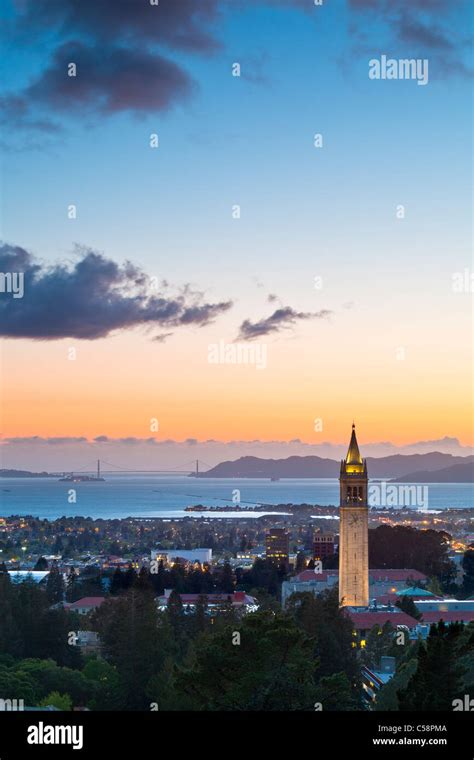 The Campanile Sather Tower Of UC Berkeley Aglow At Sunset With The San Francisco Bay In The
