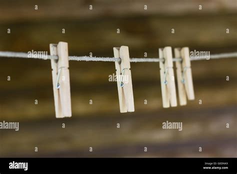 Wooden Clothespins On The Clothesline Stock Photo Alamy