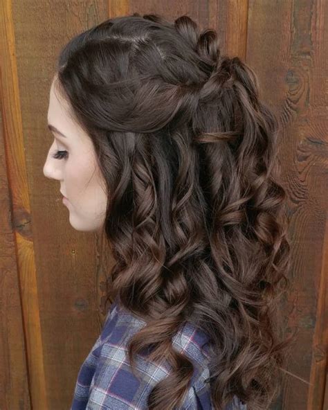 Use floral accessories and framing tendrils to dress up a simple pinned updo. 50 Party Hairstyles That Are Fun & Chic for 2019