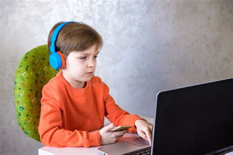 Technology Home Education And People Concept Boy In Headphones