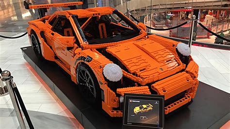 The model in authentic 'lava orange', uses 2,704 pieces to create a sleek, aerodynamic. Full-scale Porsche 911 GT3 RS brings a Lego kit to life