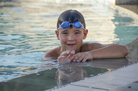 Little Kid With Underwater Goggles In Swimming Pool Stock Image