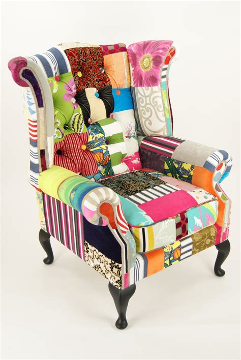 An Upholstered Chair With Colorful Fabrics On Its Back And Arms In