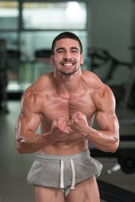 Muscular Man Flexing Muscles In Gym Stock Image Image Of Exercises