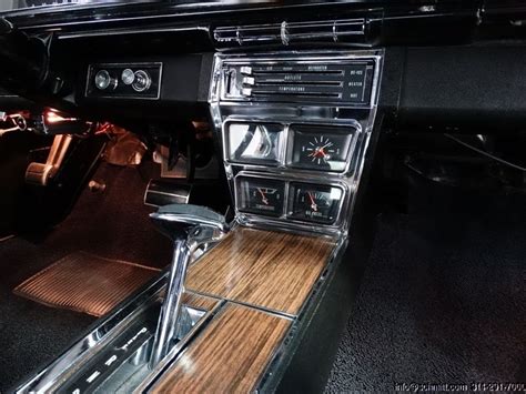 The Interior Of An Old Car With Wood Flooring And Dash Board Including