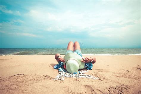 Young Women Lying On A Tropical Beach Relax And Sunbathe Stock Image Image Of Brown Ocean