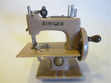 Compare the latest singer mobile prices and read faqs. Singer Tan Metal Mini Sewing Machine From Great Britain ...