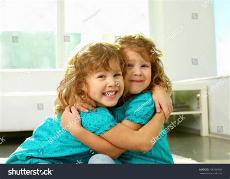 Portrait Cheerful Twin Sisters Hugging Smiling Stock Photo 106109285