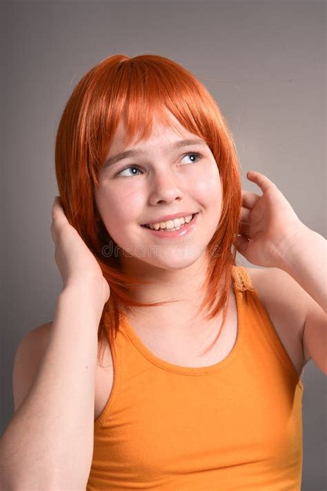 Portrait Of Cute Girl With Red Hair Posing In Studio Stock Image