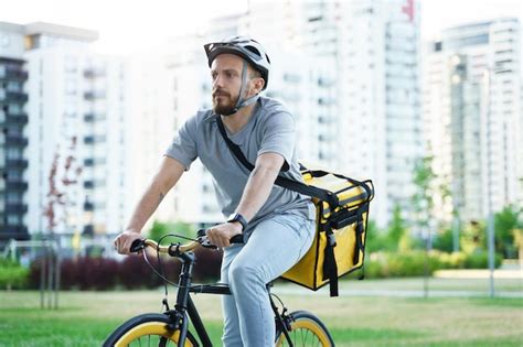 premium photo express delivery courier riding bicycle with insulated bag