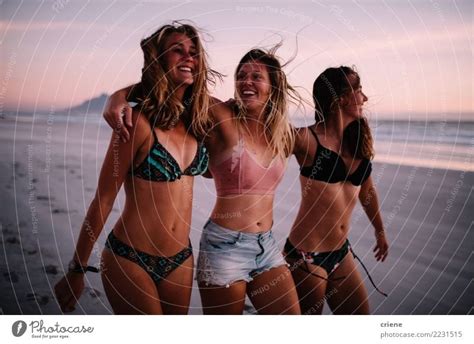 Group Of Female Friends Walking On The Beach In Sunset A Royalty Free Stock Photo From Photocase