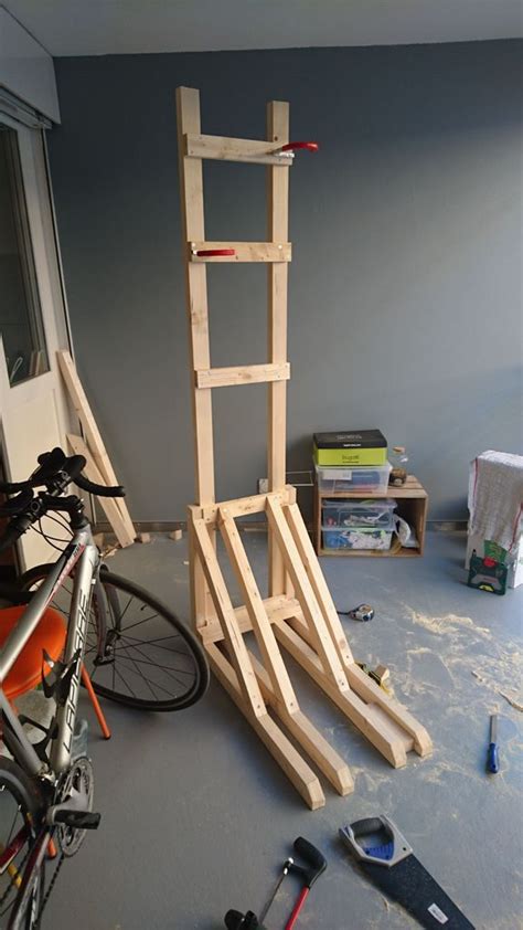 There Is A Wooden Ladder Next To A Bike