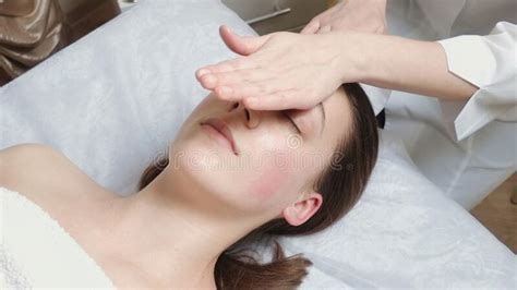 Brunette Woman Gets A Facial Massage Course In Salon Stock Image Image Of Relax Health 220406087