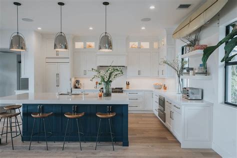 Such a bright and updated look, achieved with the gorgeous color scheme of general finishes antique white and coastal blue milk paints, perfectly finished off with sleek new hardware in oil rubbed bronze. Blue and White Coastal Kitchen - Waterview Kitchens