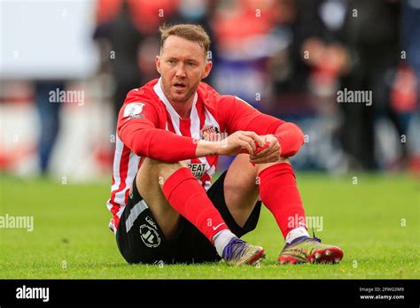 Aiden Mcgeady 28 Of Sunderland Sits On The Pitch Looking Disappointed