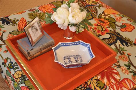 This is a relatively easy do it yourself project. Turn any ottoman into a coffee table by using a large tray ...