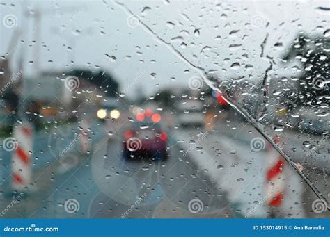Inside Car When Rainning Road View Wtih Restriction Signs Through Car