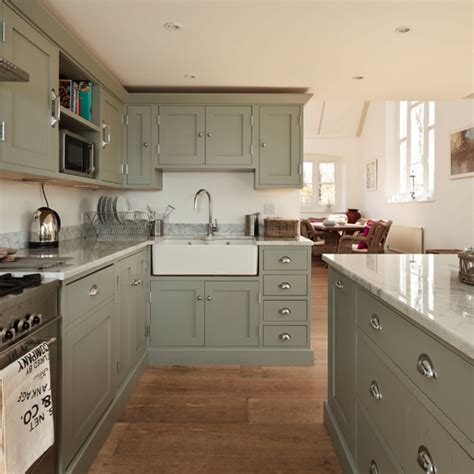 Painted kitchen cabinet ideas include traditional paints, gel stains and crackle paint coatings. Green painted kitchen | Decorating ideas | Ideal Home