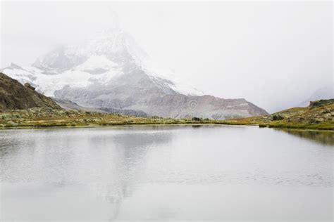 Switzerland Valais Alps Matterhorn Lake And Fog Stock Image Image