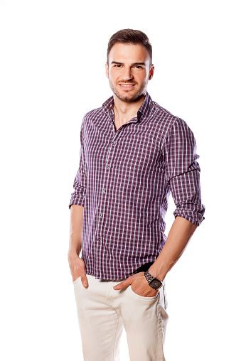 Happy Young Man Posing With His Hands In Pockets Stock Photo Download
