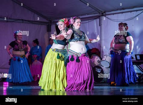 Tribal Belly Dancers In Colorful Gypsy Costumes Performing On Stage
