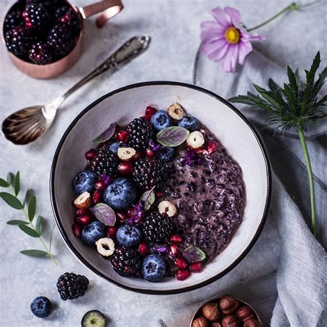 Black Rice Pudding With Hazelnut Milk Berries Pomegranate Seeds And