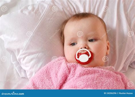Little Girl With A Charming Pacifier Lying Stock Photo Image Of