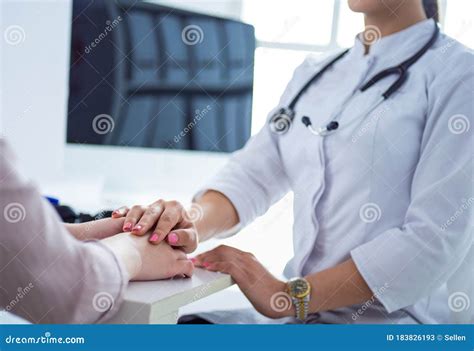Female Doctor Giving A Consultation To A Patient And Explaining Medical