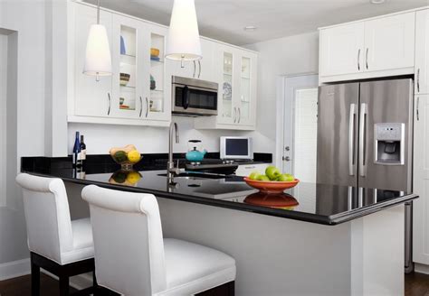 I love the black stainless steel handles. black quartz countertops kitchen transitional with stone ...