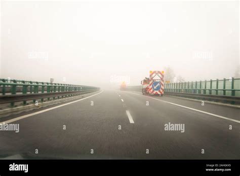 Thick Heavy Dense Fog Winter European Route E55 D3 Motorway Road Workers Vehicles South