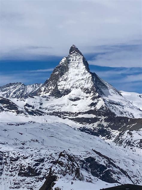 The Impressive Matterhorn Mountain With Cloudy And Blue Sky In