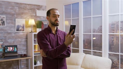 Man Turns Off Lights With Smart App Leaves Stock Footage Sbv