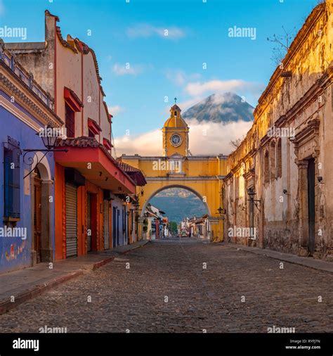 Cityscape Of The Agua Volcano And Antigua Main Street At Sunrise With