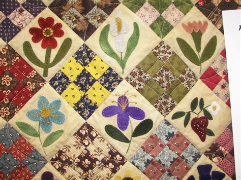 nine-patch-and-little-appliqued-flowers-close-up-quilts,-applique